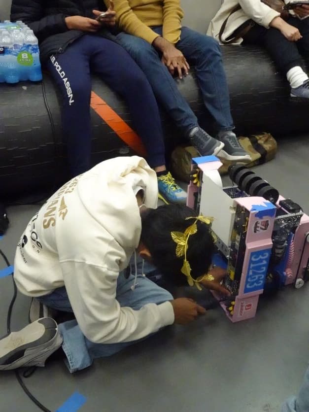 Olympians team at an FTC competition event