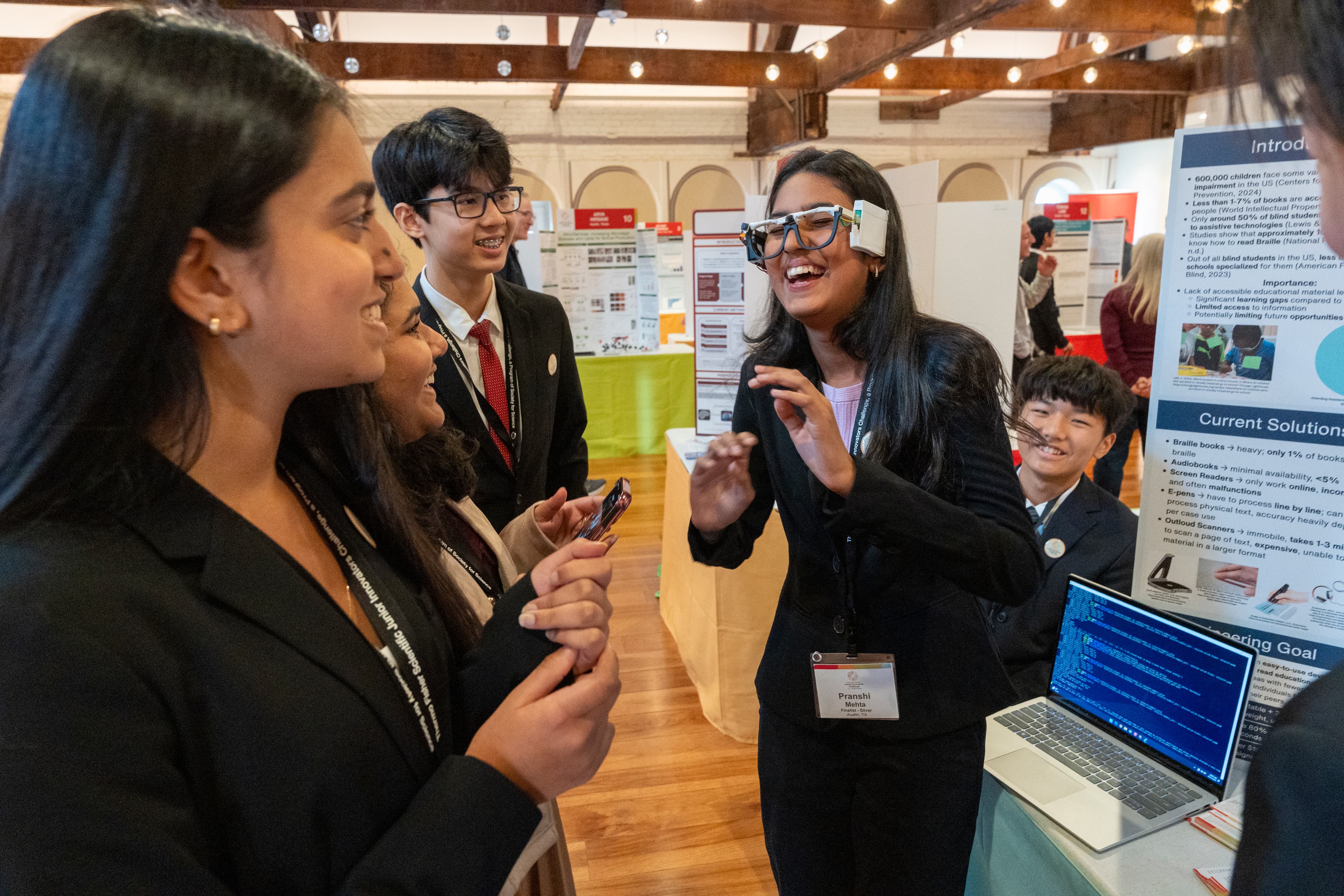 Students trying Visionary AI Glasses during Thermo Fisher JIC public day