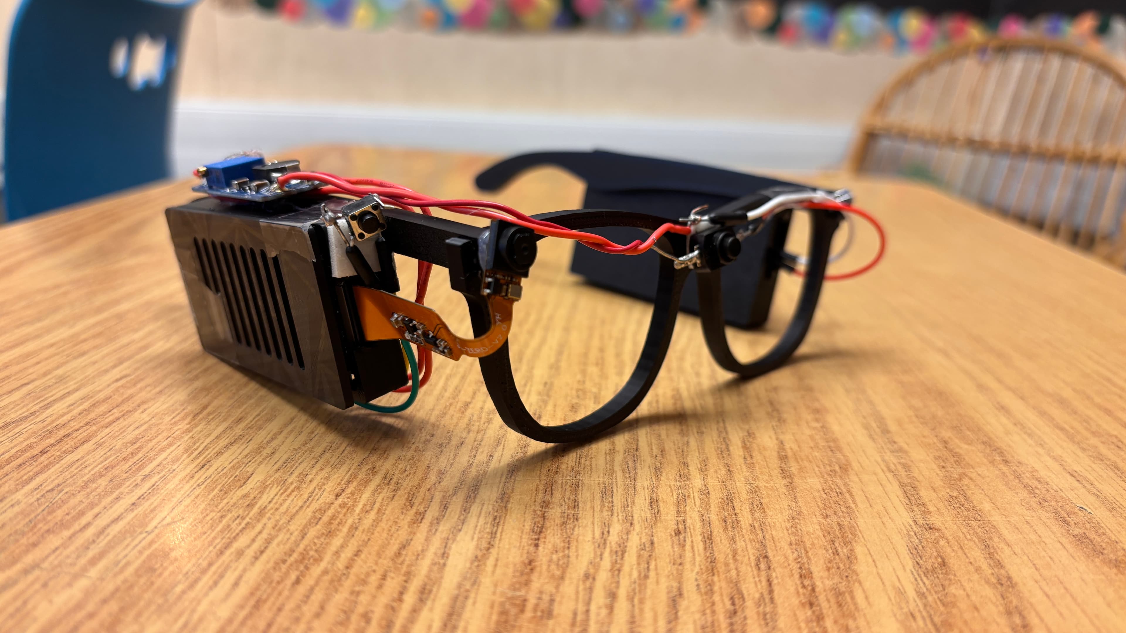 Close-up of the Visionary AI Glasses prototype with mounted electronics and camera hardware
